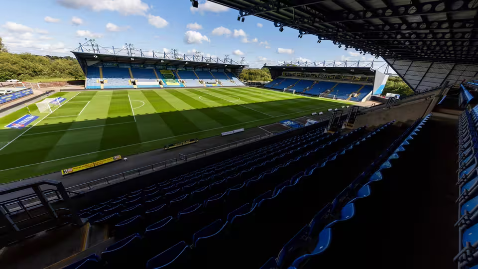 A photo of Oxford United F.C.'s Kassam Stadium, showing the football pitch from one of the seats in the stands.