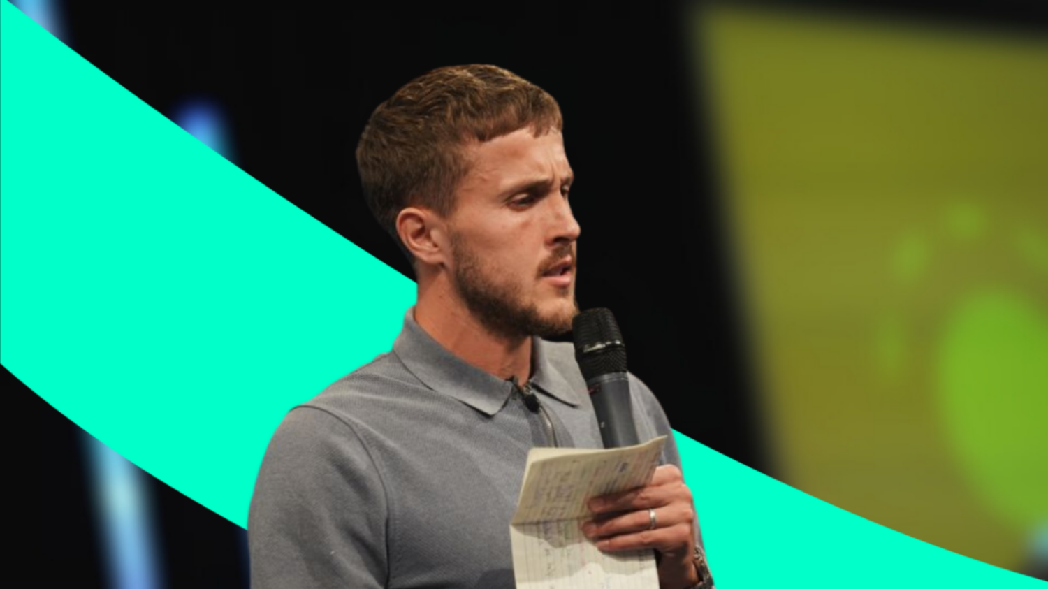 A photo of professional footballer Will Vaulks standing on a stage delivering a speech with a microphone in his hands. A bright green swirl graphic has been edited in behind him.